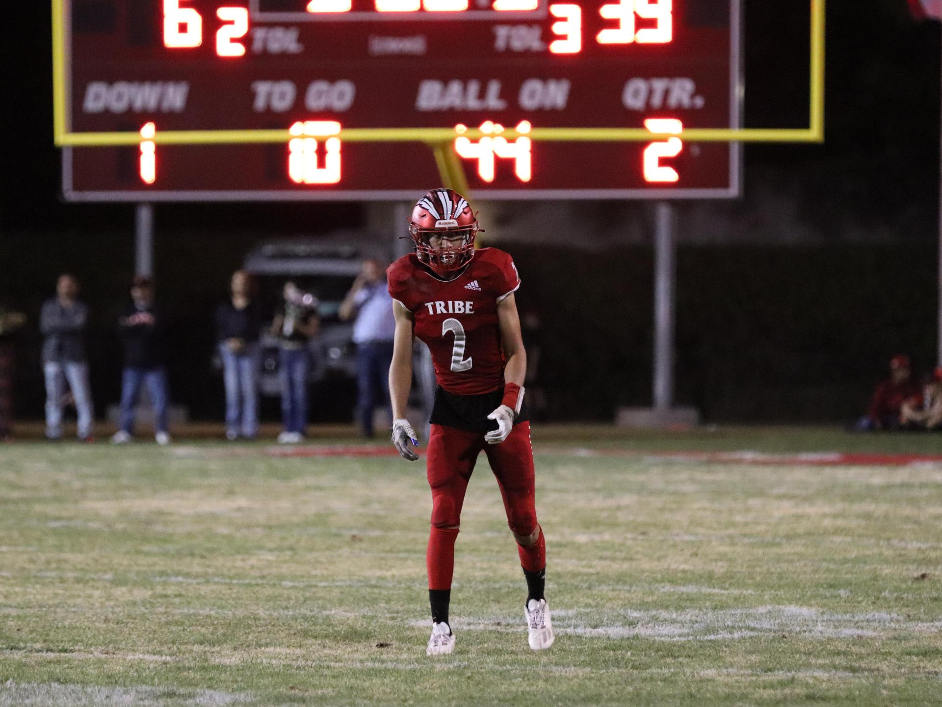 varsity football players in action against Riverdale