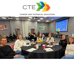 six school counselors sitting at table