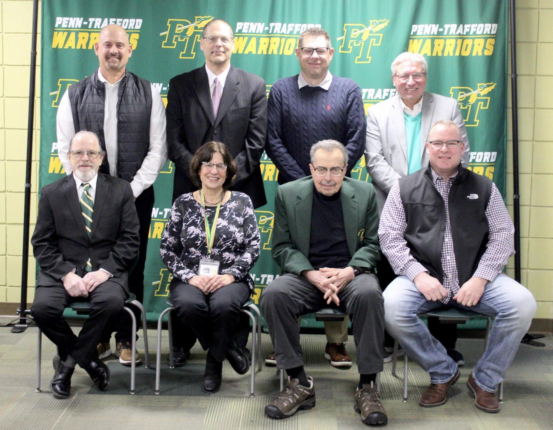 Members of the school board seated and standing for a group photo