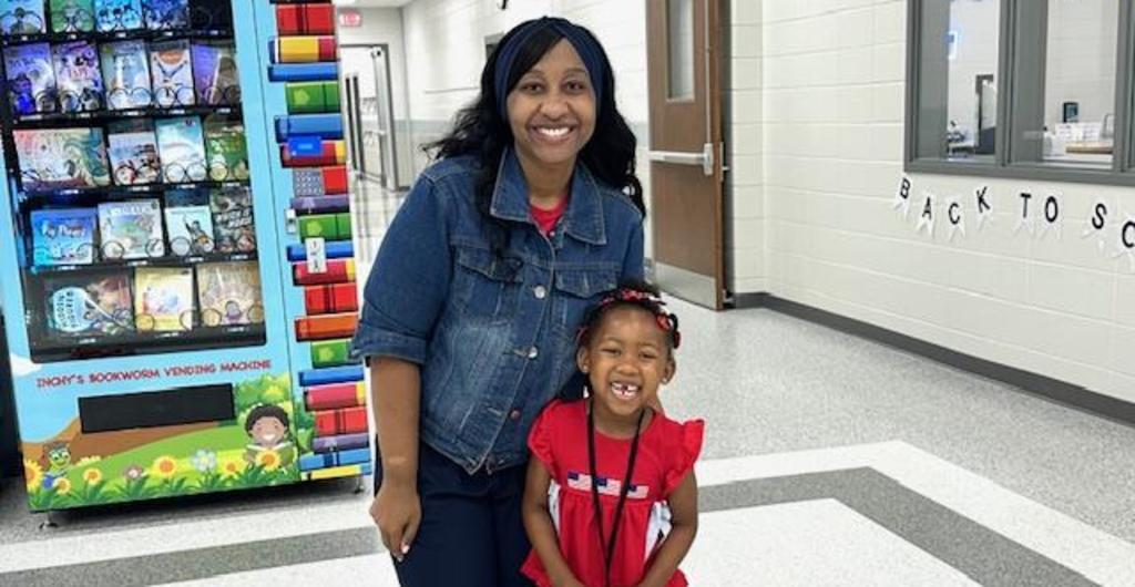 Teacher posing with student