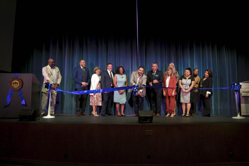 School Board and Administration pictured cutting the ceremonial ribbon during the grand re-opening
