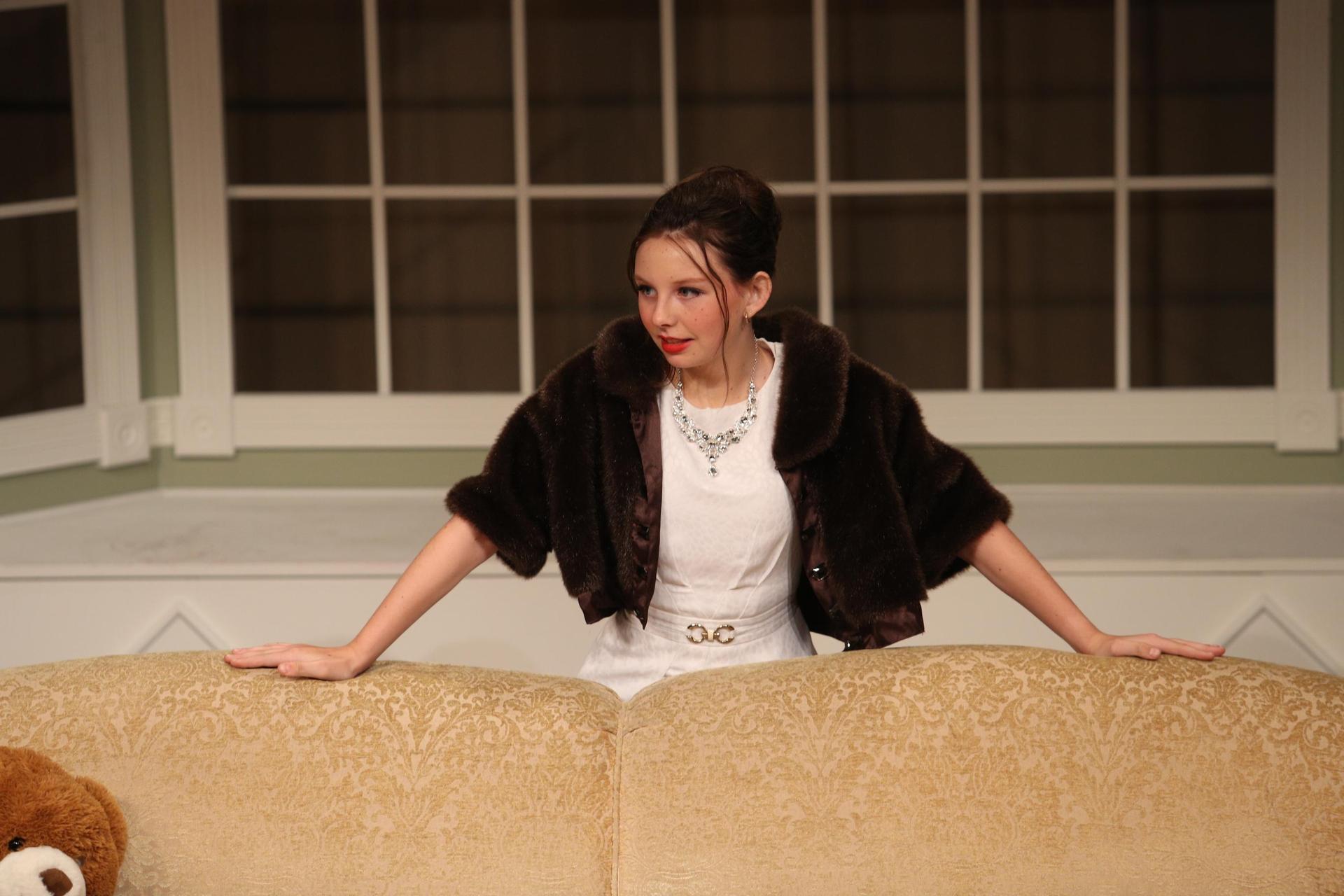 Character standing angry near a couch