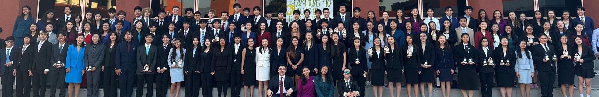 Team photo in front of Library