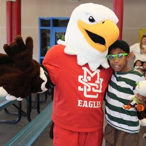 MSJC mascot, Ernie the Eagle with elementary student