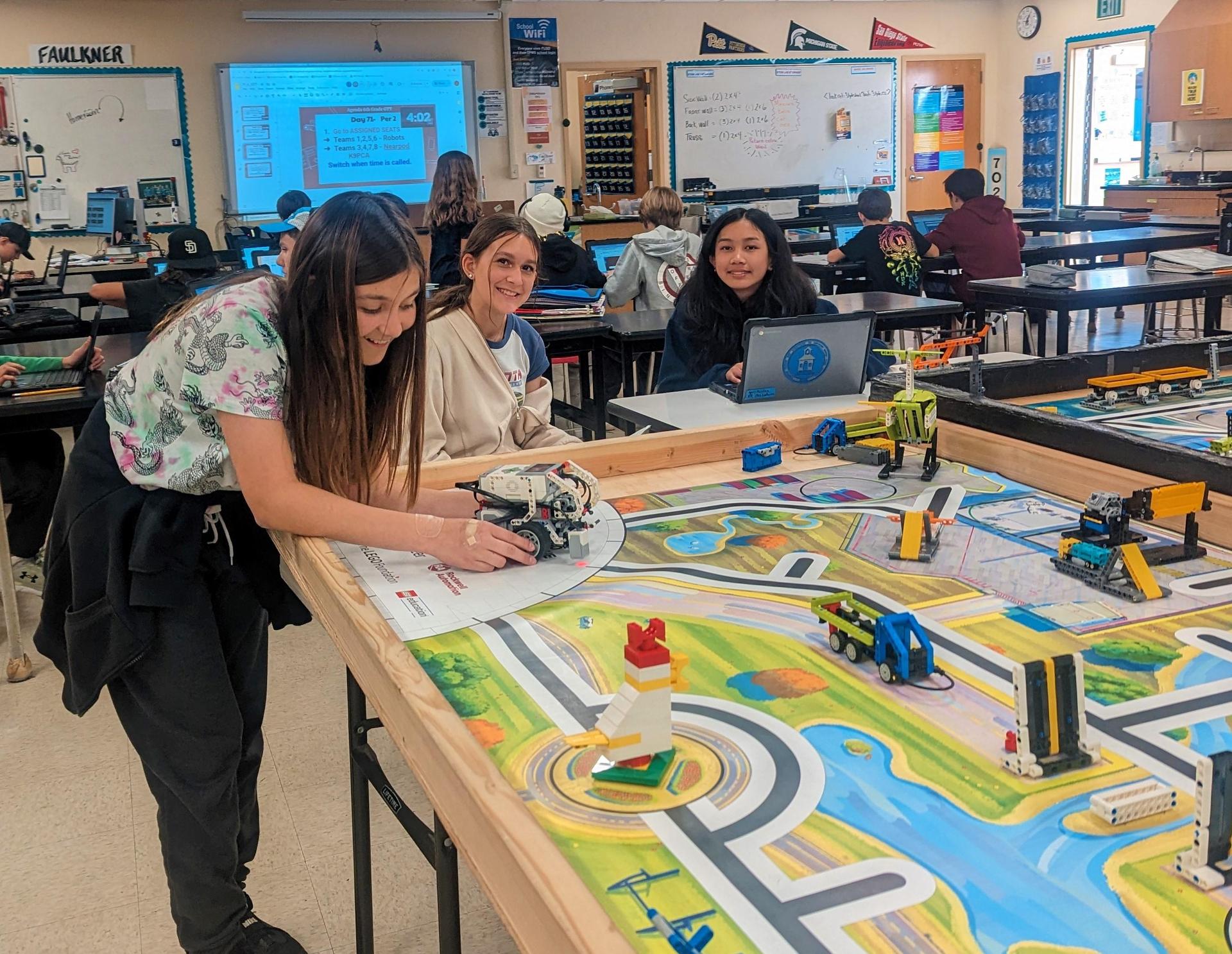 Middle school students working on Lego robotics