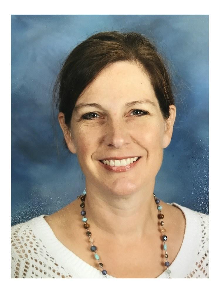 Art Teacher, Amelia Holt, with white shirt