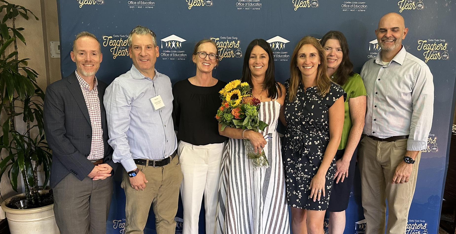 Teacher of the Year Kristi Gingrich with District staff and Board members.