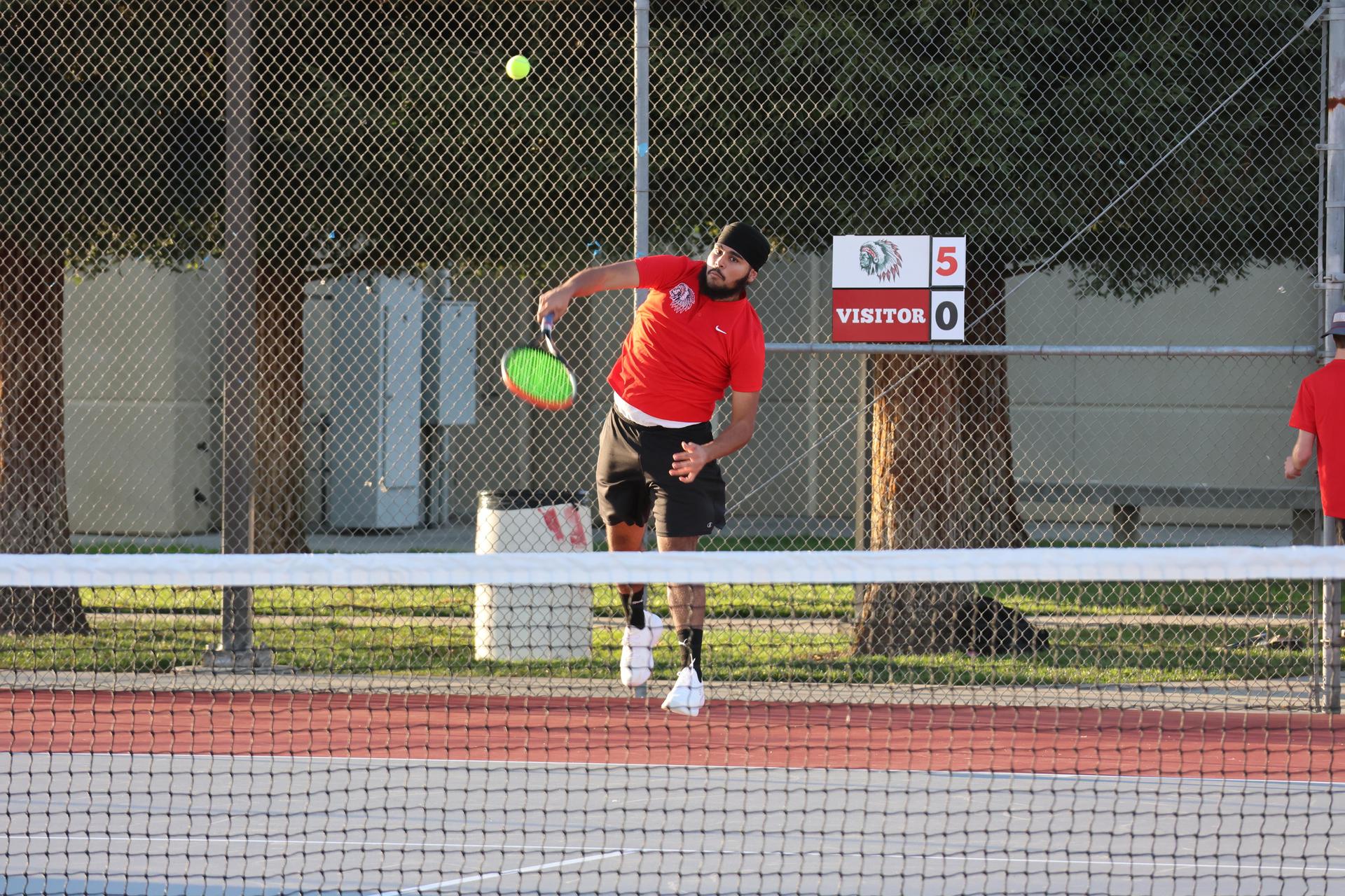 CUHS Boys playing tennis against coalinga