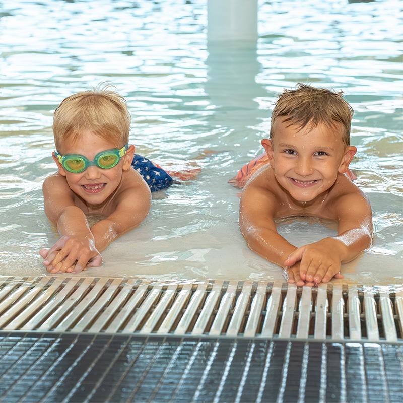Two young boys in swimming pool