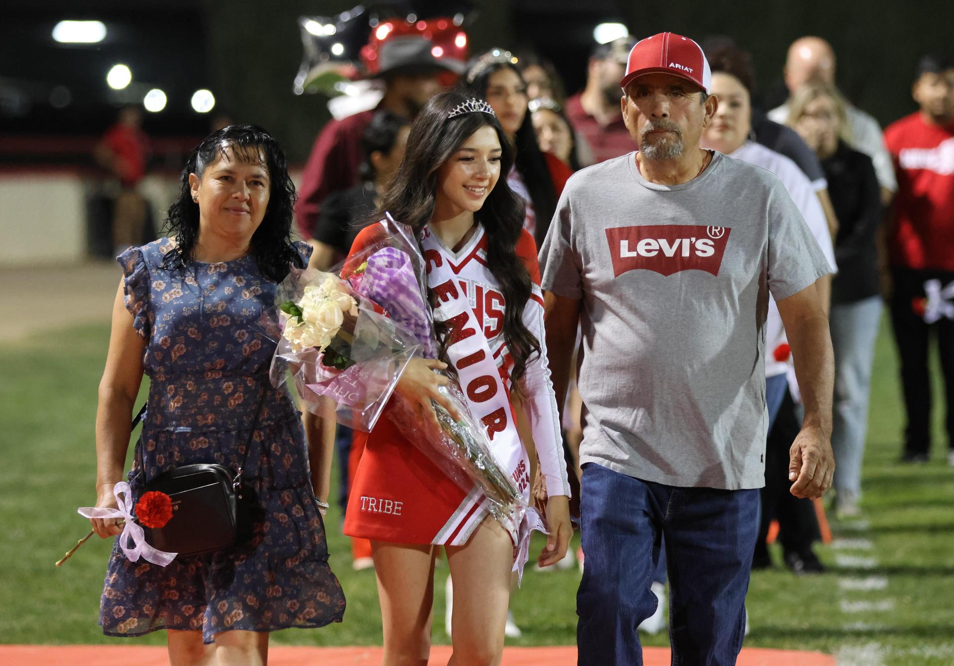 seniors and their escorts celebrating senior night