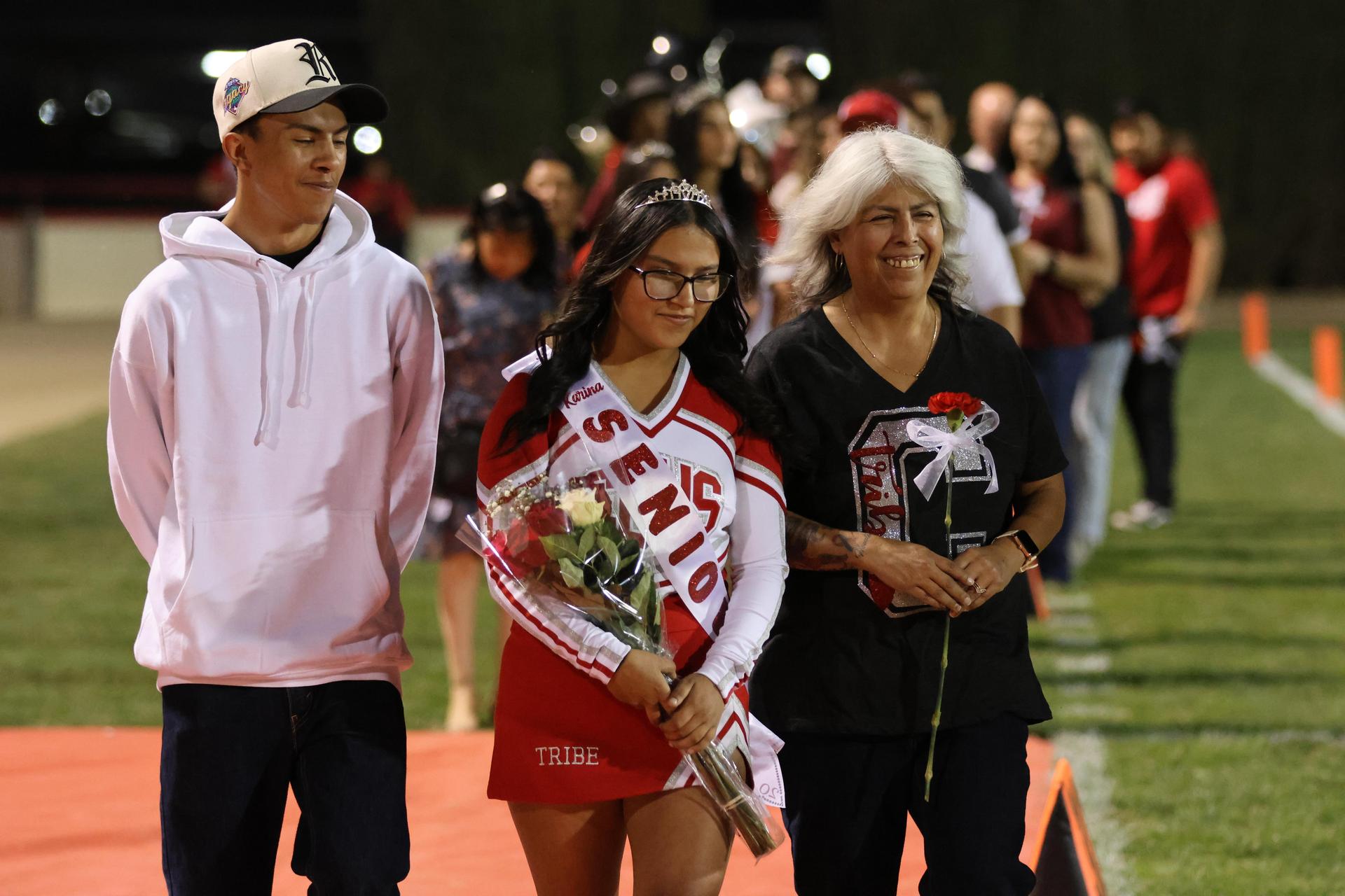 seniors and their escorts celebrating senior night