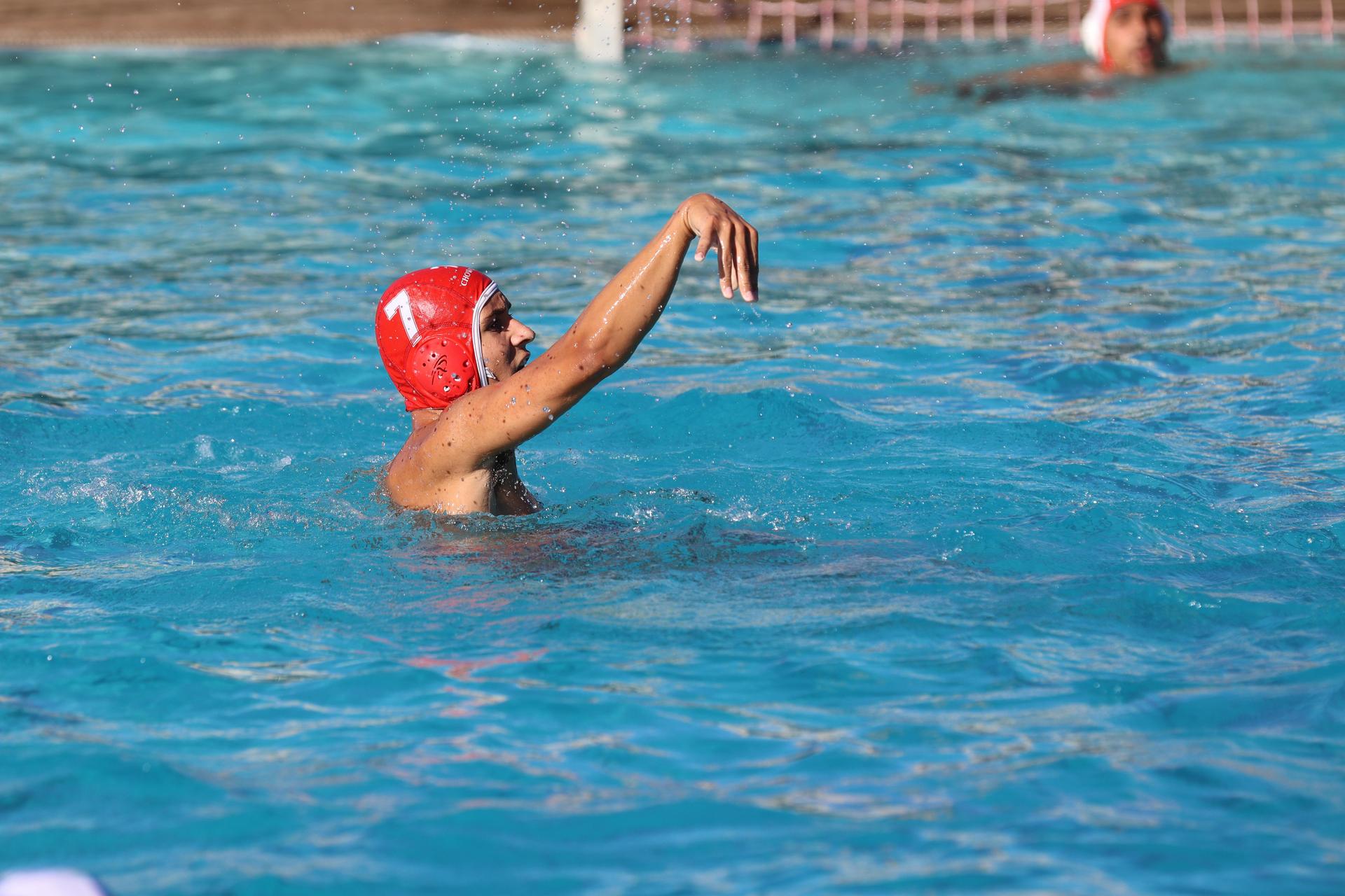 boys playing water polo against Madera