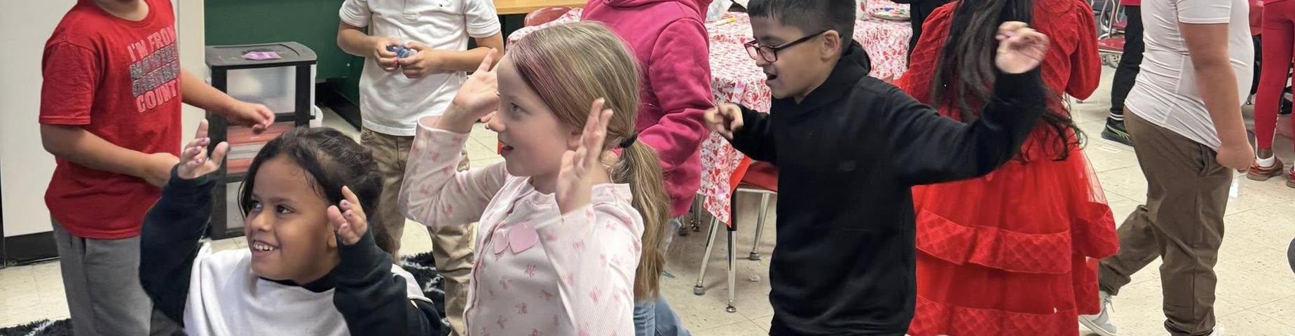 MES students playing at the Valentines Day party.
