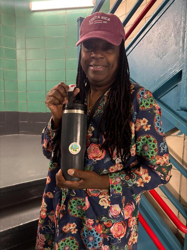 Teacher with their reusable bottles instead of plastic bottle