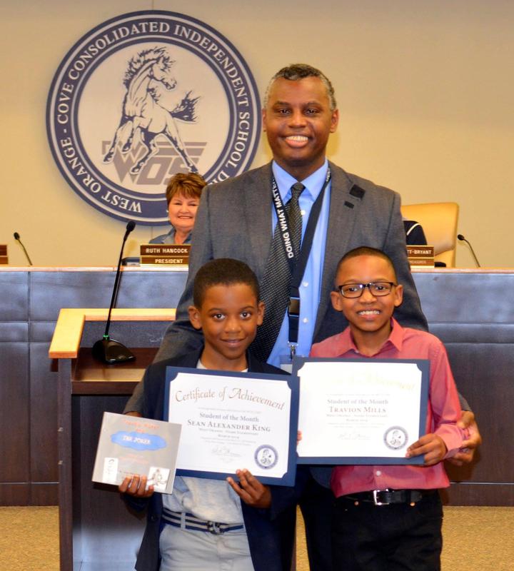 Dr. Bethley presents Author and Illustrator certificates.