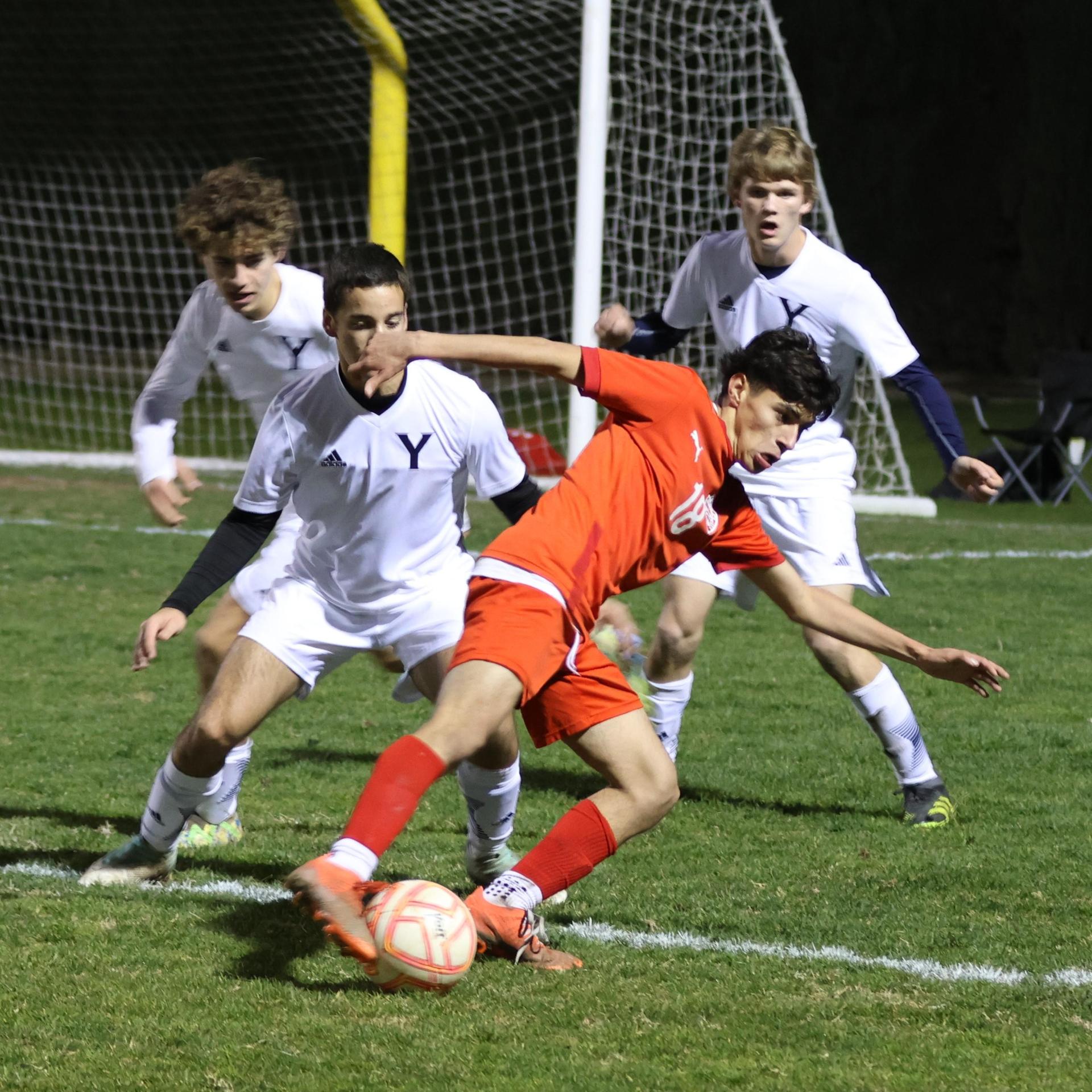 varisty boys soccer playing against yosemite