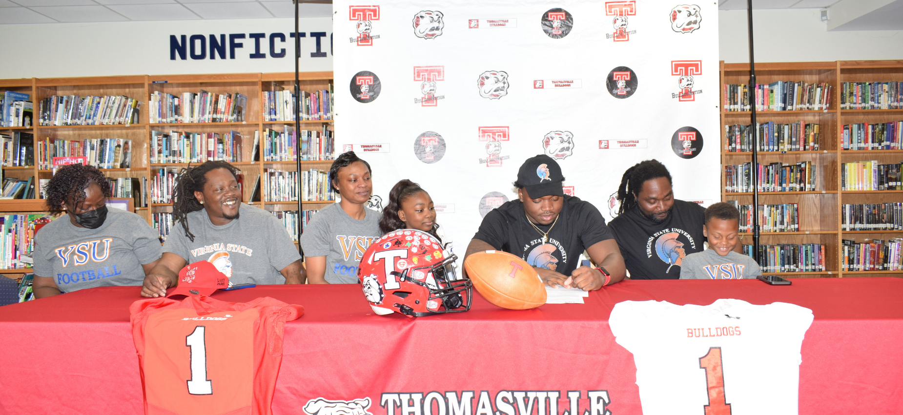 Jabrii Carolina signs his letter of intent to Virginia State University with his family
