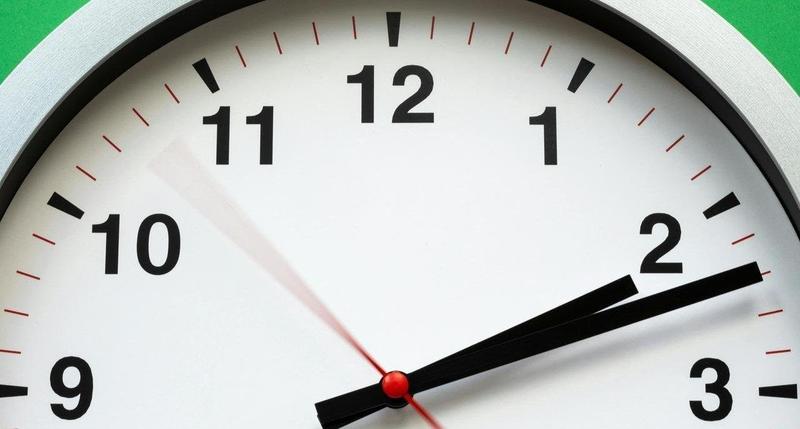 Top half of a clock that reads 2:12