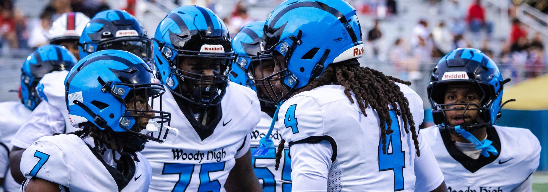 Football players celebrate after a touchdown