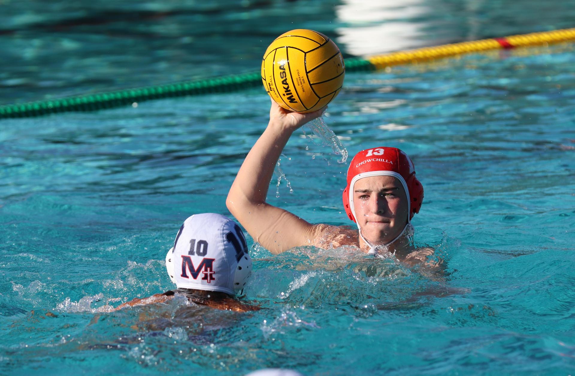 boys water polo players in action against san joaquin memorial