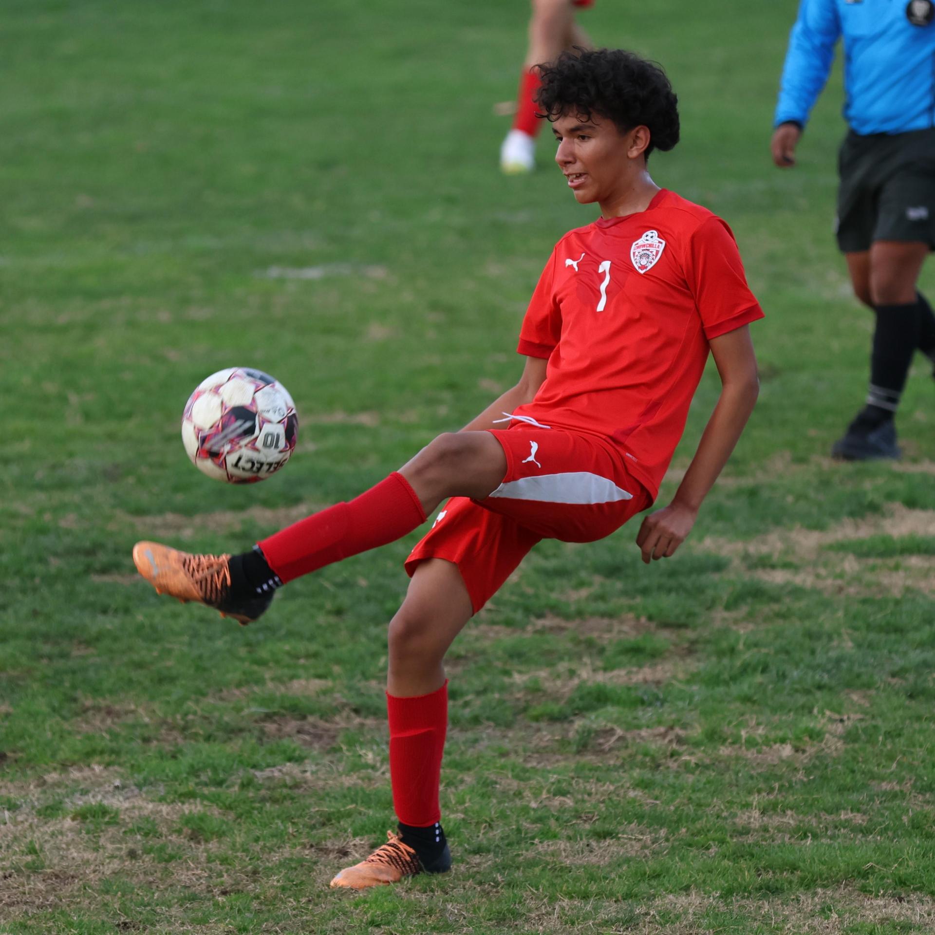 Junior Varisty boys playing soccer against Kingsburg