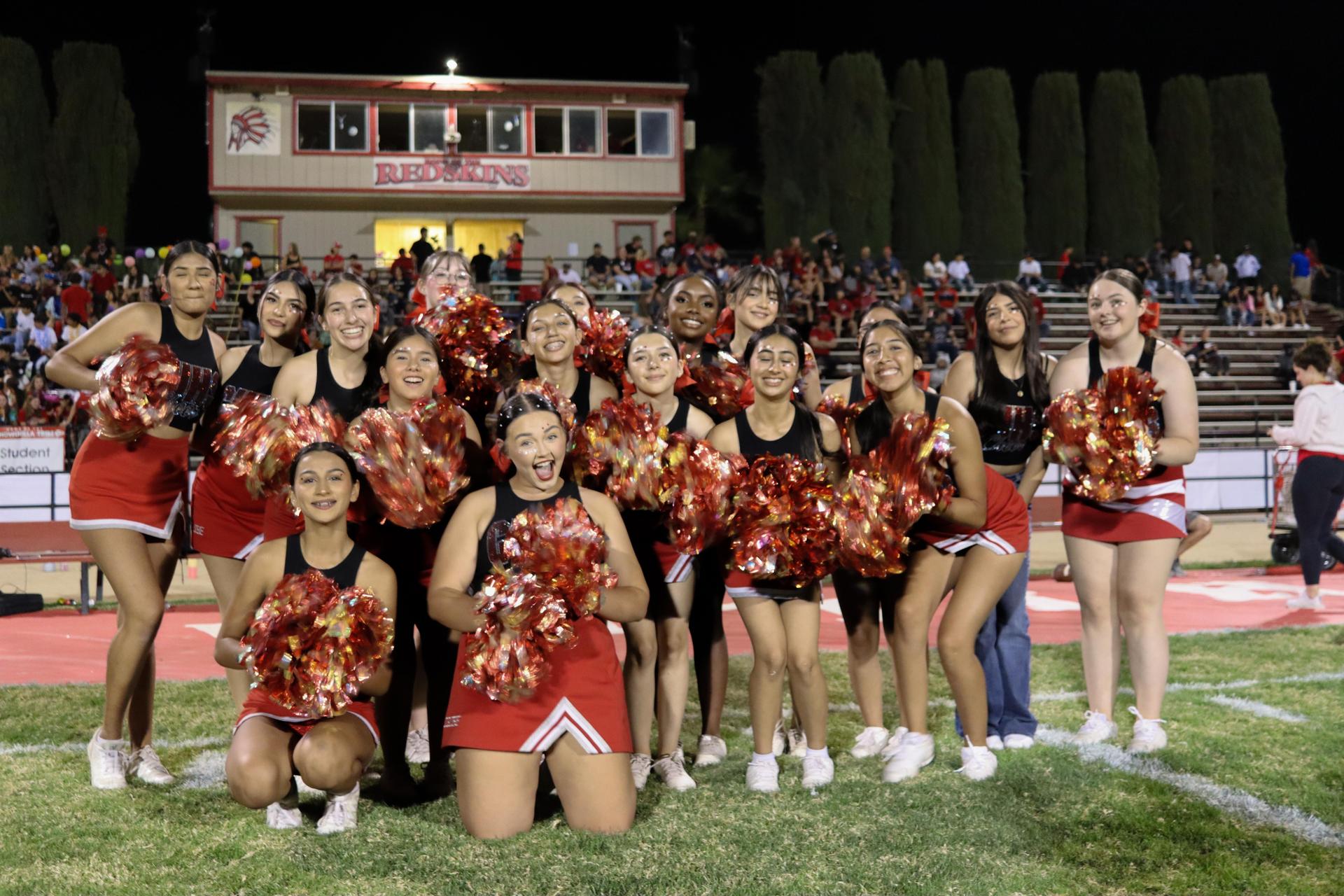 Varsity girls cheering at the Parlier football game