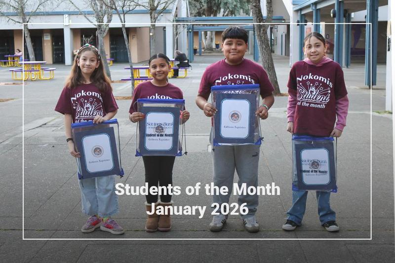 Students holding a bag