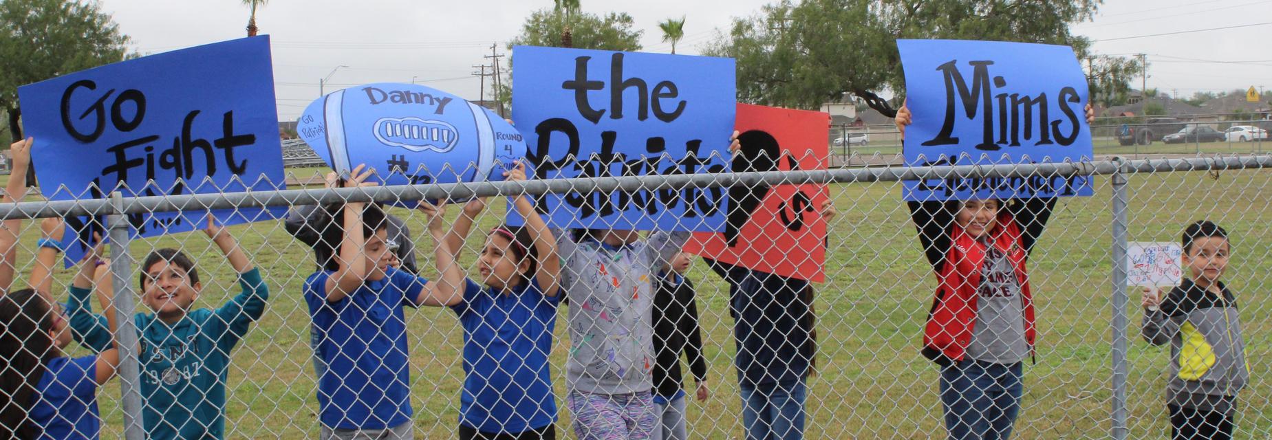 students with signs