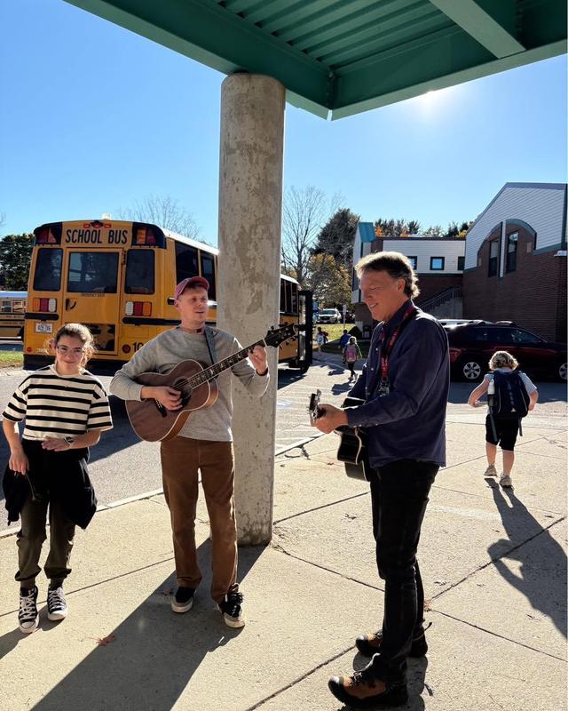 MR. Gagnon and Dr. Selby playing music for students after school on Friday