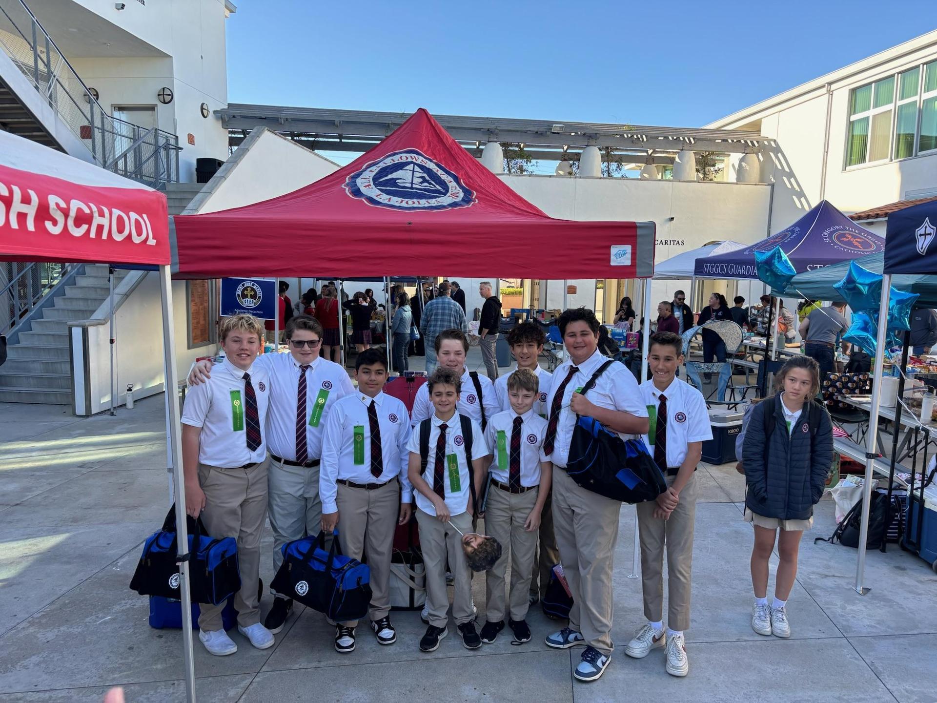 10 Decathletes posing in frontof AHA Table