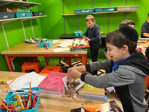 A third grade boy's bridge collapses from the weight of the pennies.