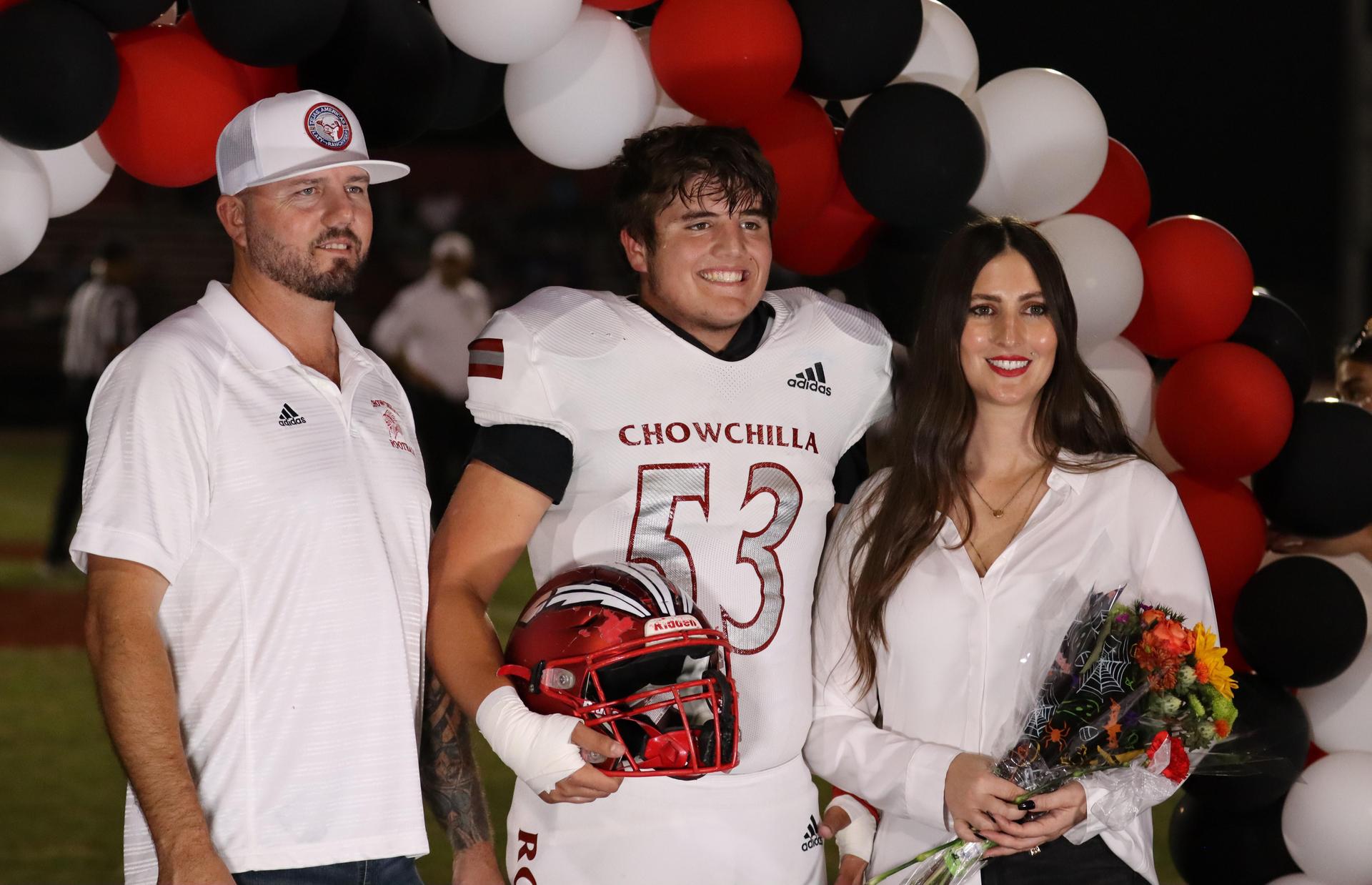 seniors and their escorts celebrating senior night