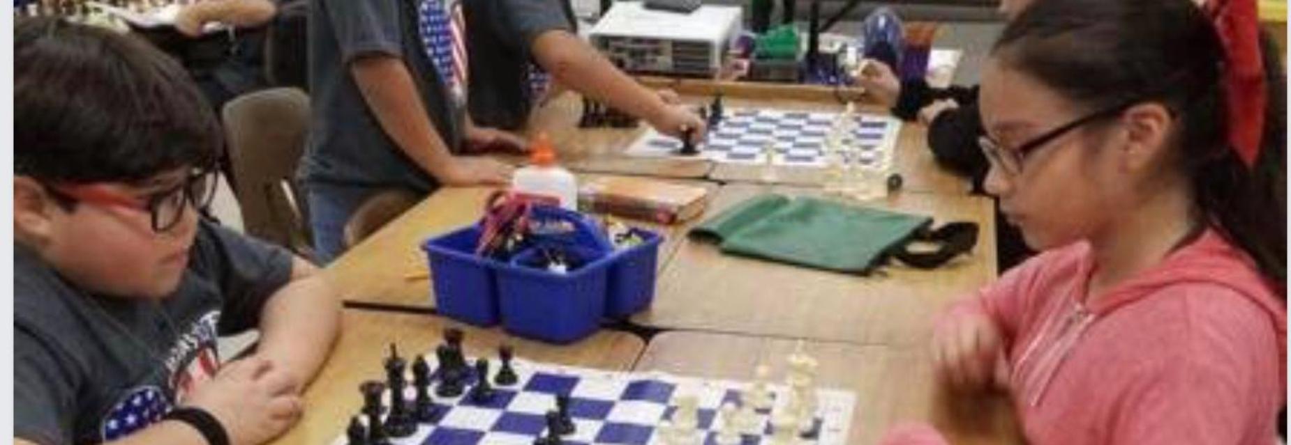 two students playing chess