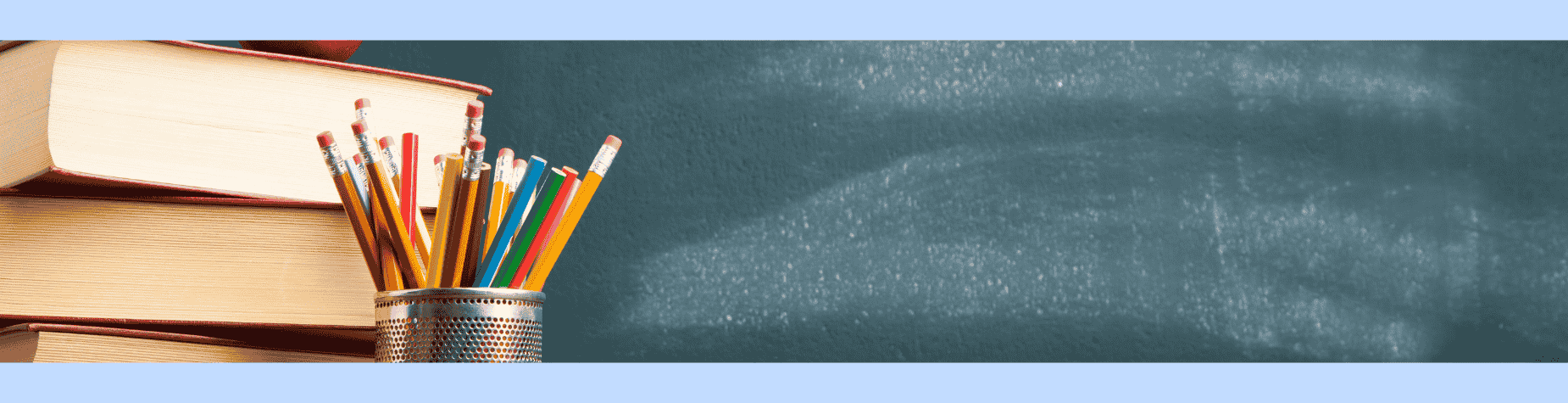 Stack of books with pencils in a jar against a chalkboard.