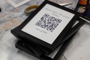 Holloway students frame QR codes for a school project