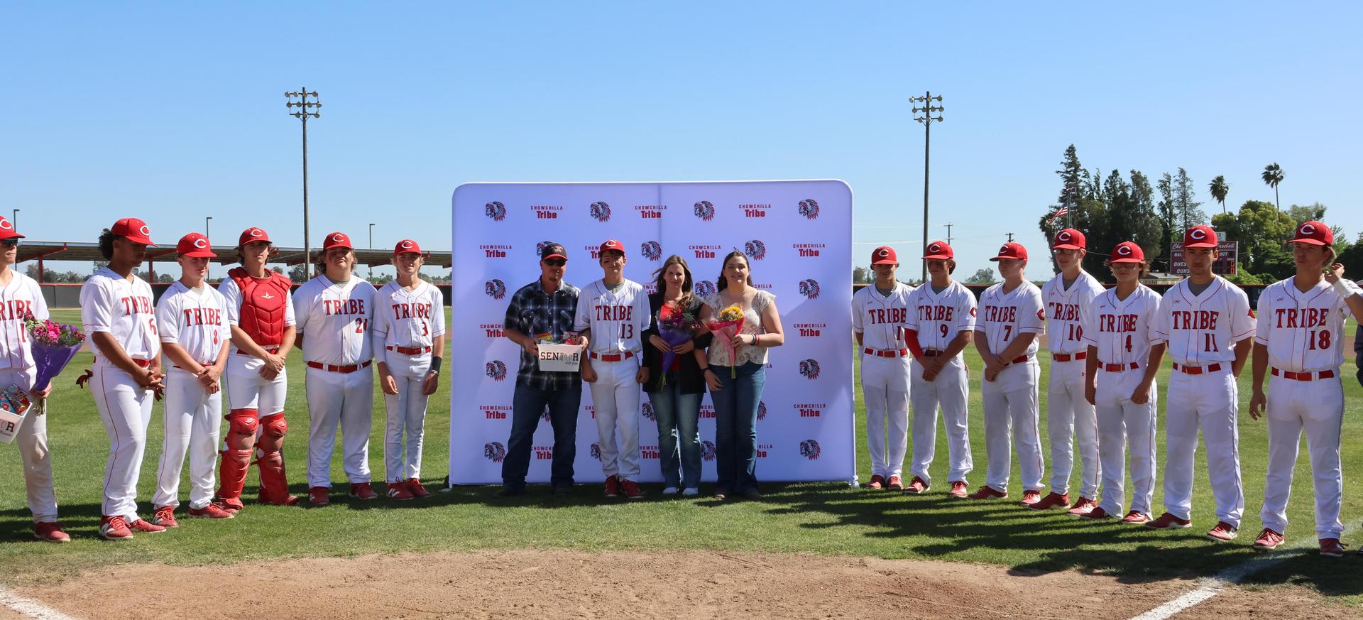 Seniors Posing With Teammates, Coaches, And Family