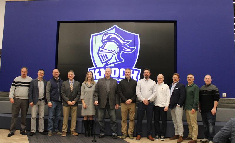 members of the sports hall of fame lined up on wall