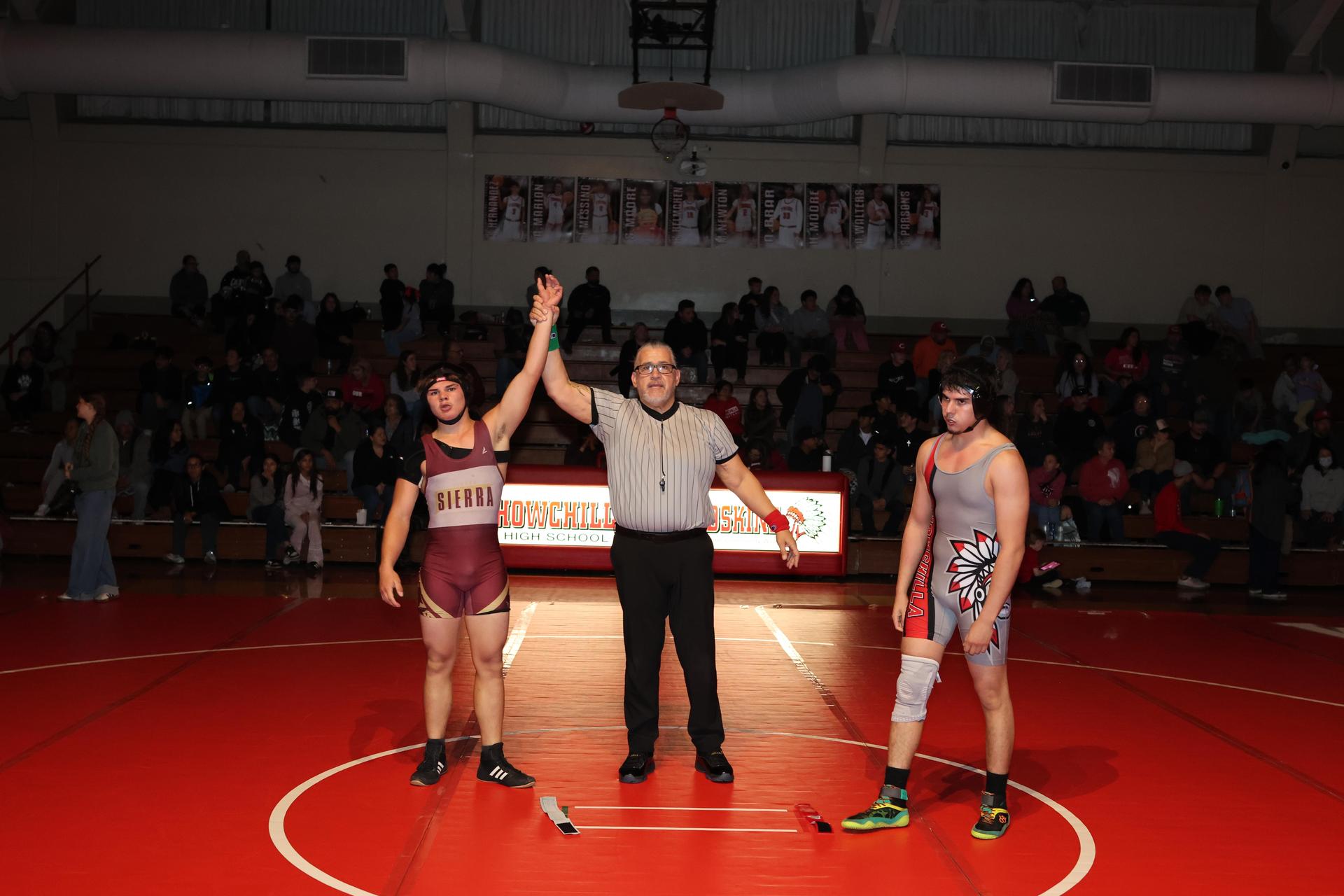 Wrestling winners with hands up 34