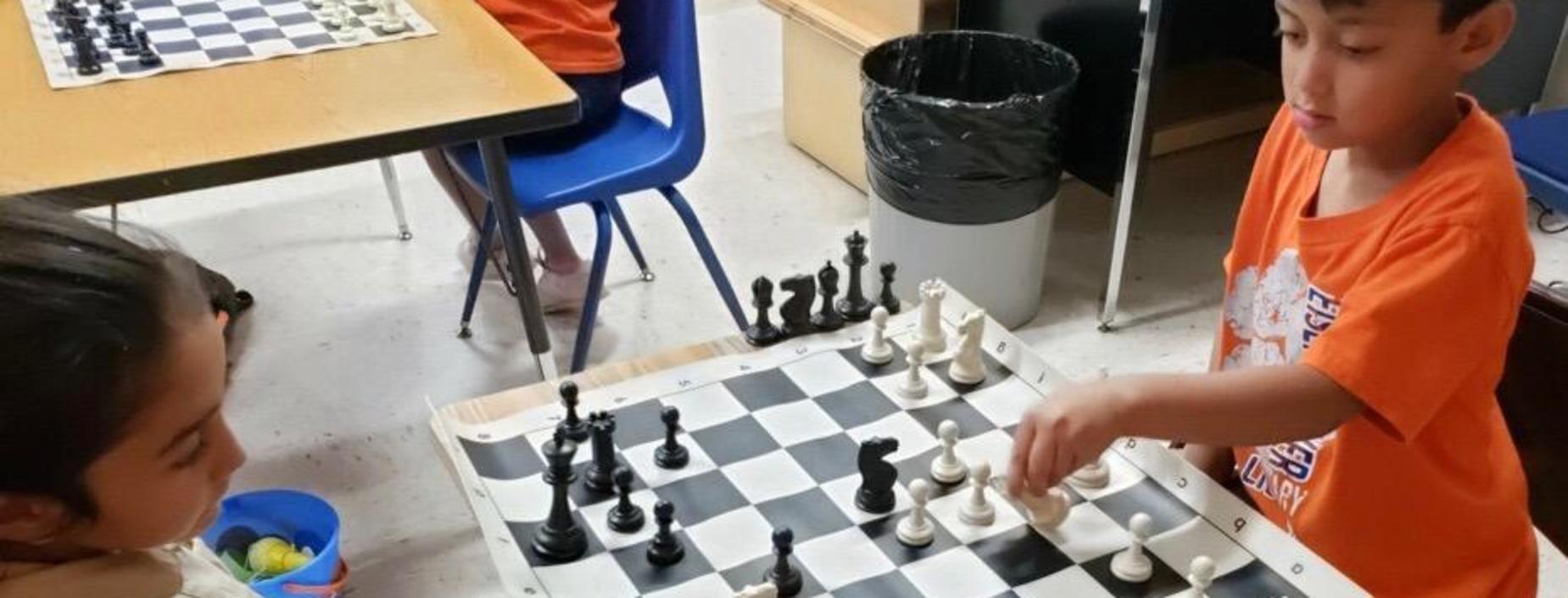 Image of students playing chess.