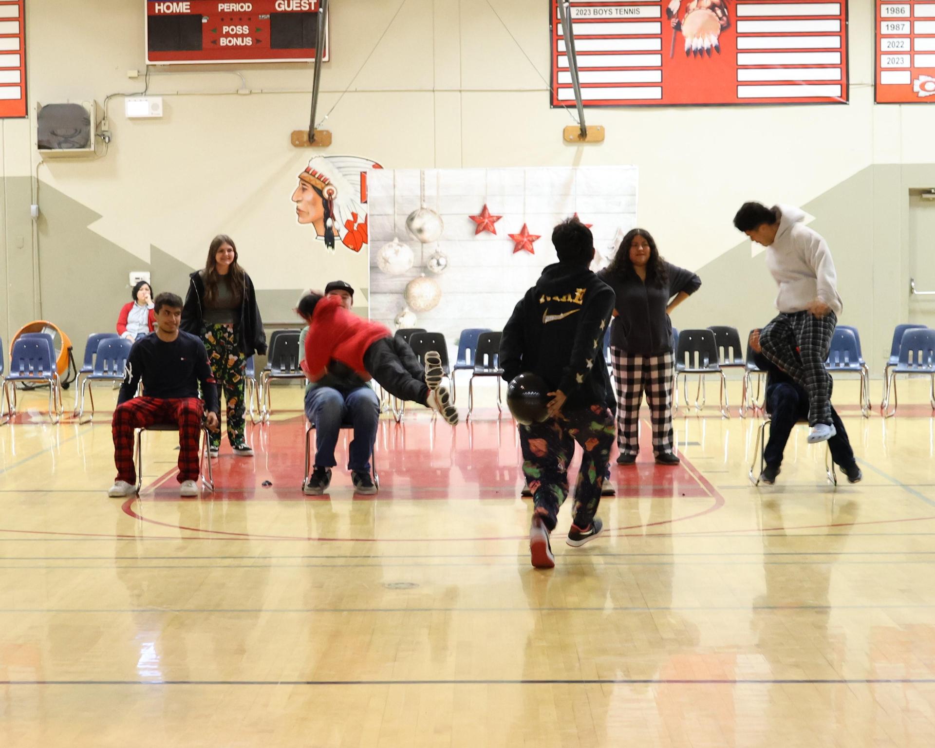 students playing the balloon pop game