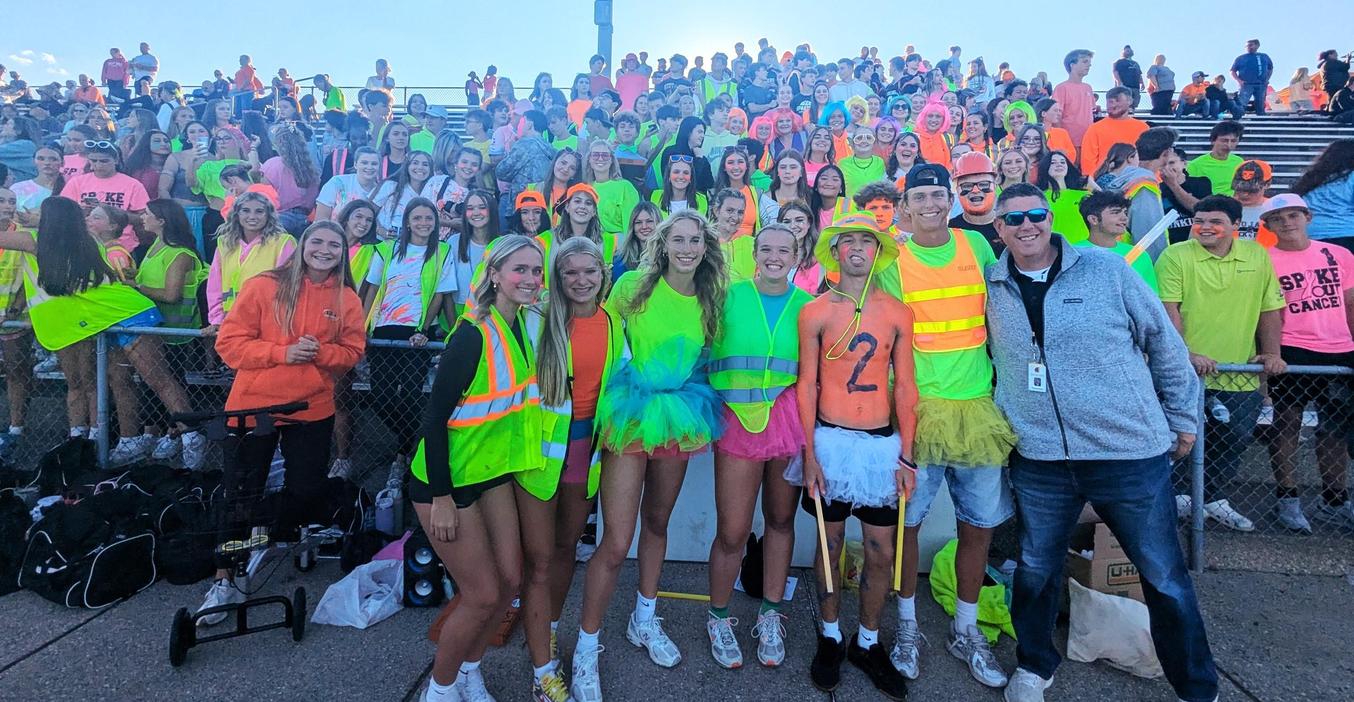 TKHS principal Tony Petersen joins the TROZONE student section for the first football game.