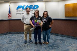 people posing in the governing board room