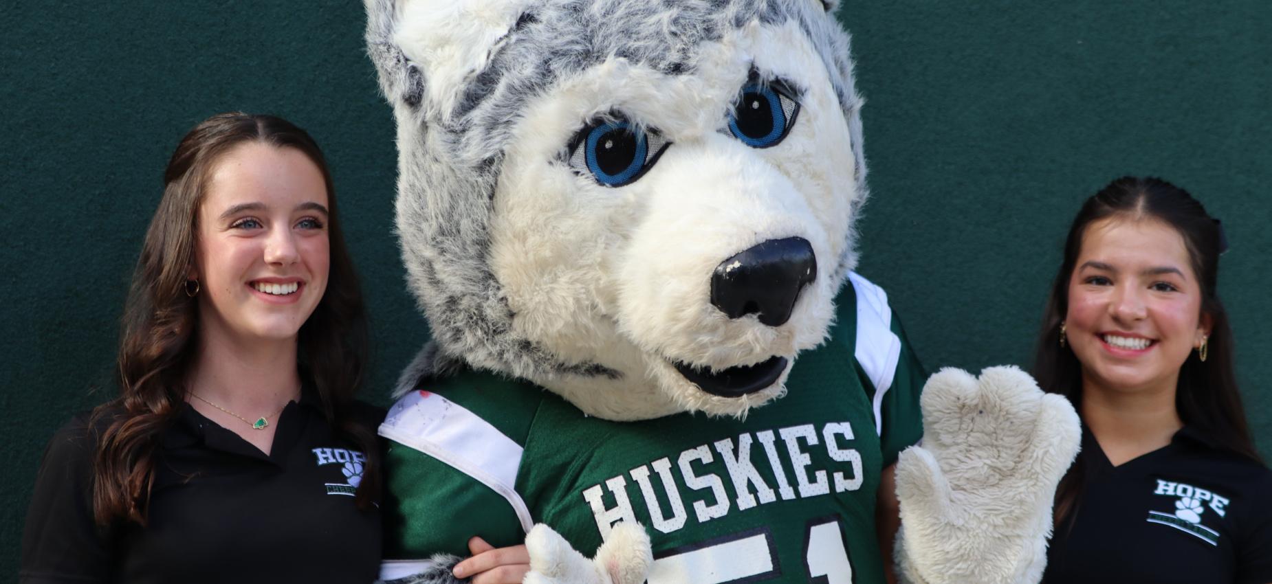 Husky and cheerleaders