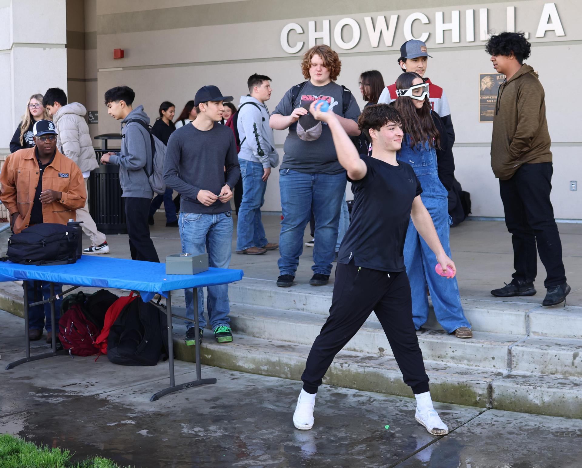 students and staff enjoying the water balloon toss