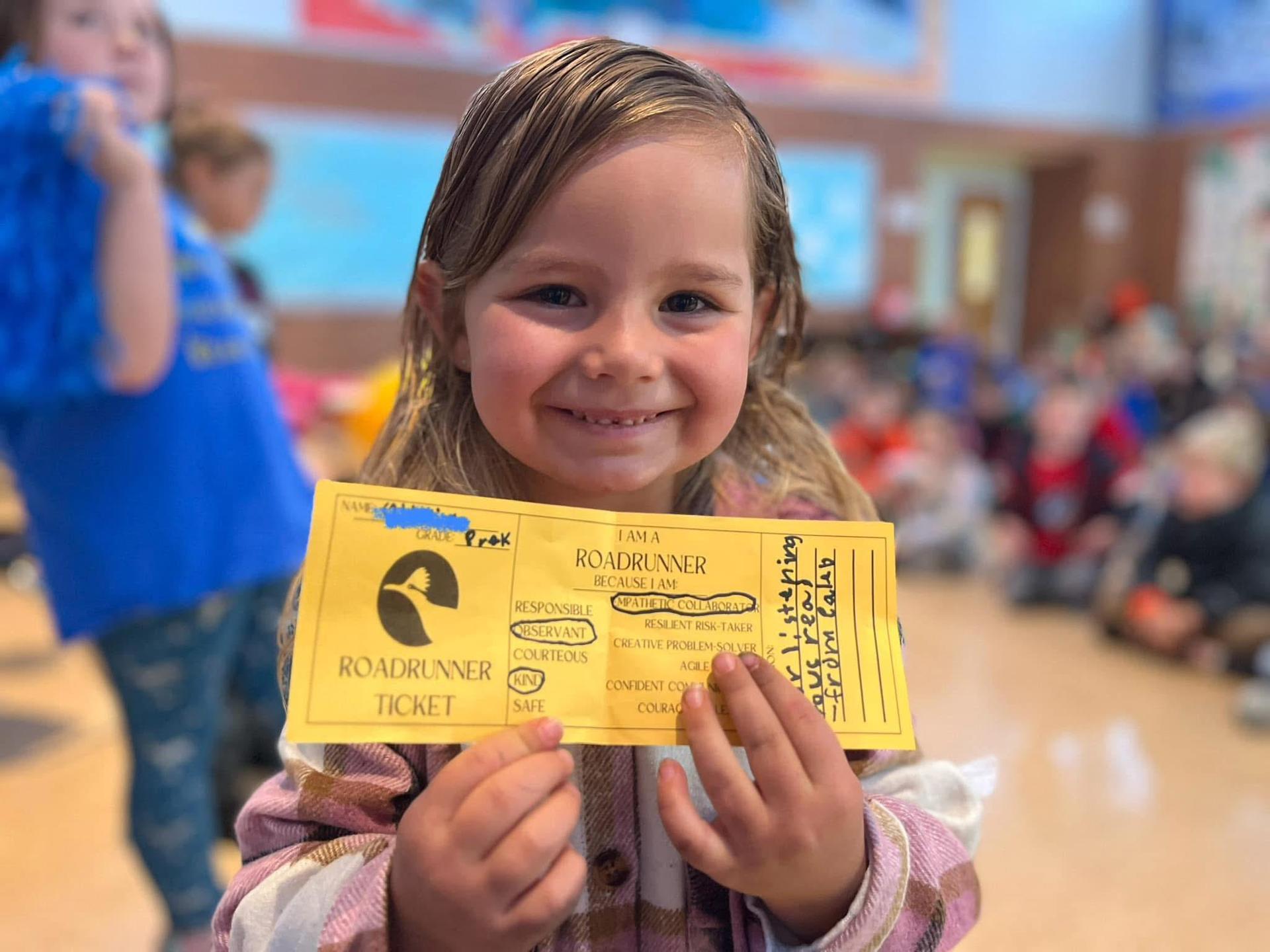 A student wins a roadrunner ticket