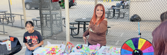 Children watching a game booth with toys and a colorful spinning wheel.