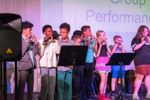 Lower schooler Preforming on Flutes During Talent Show