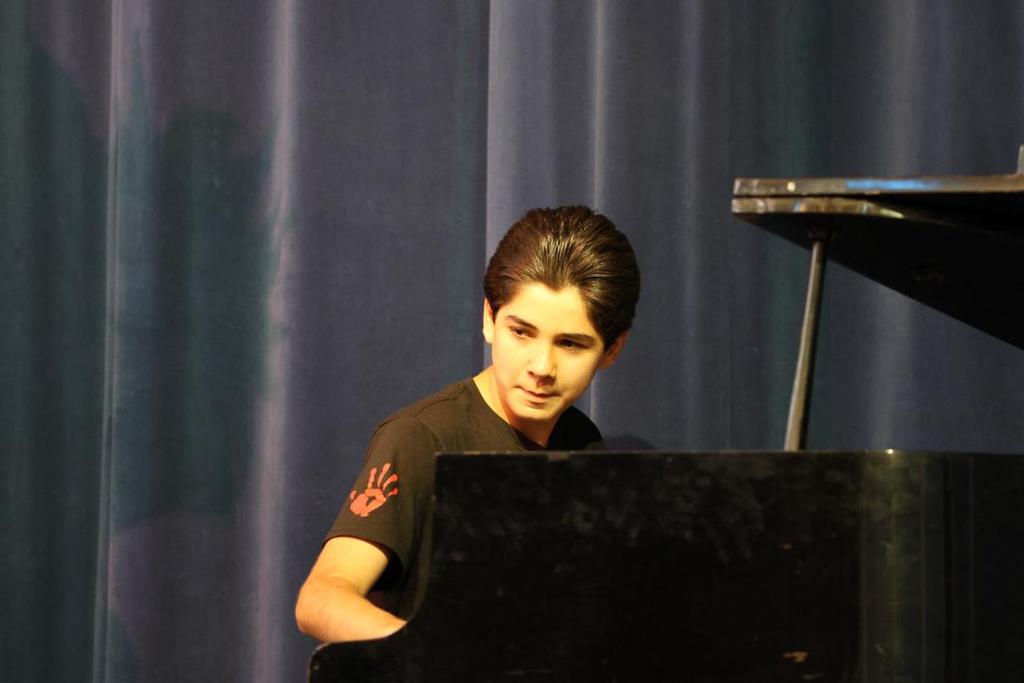 Middle school student plays piano