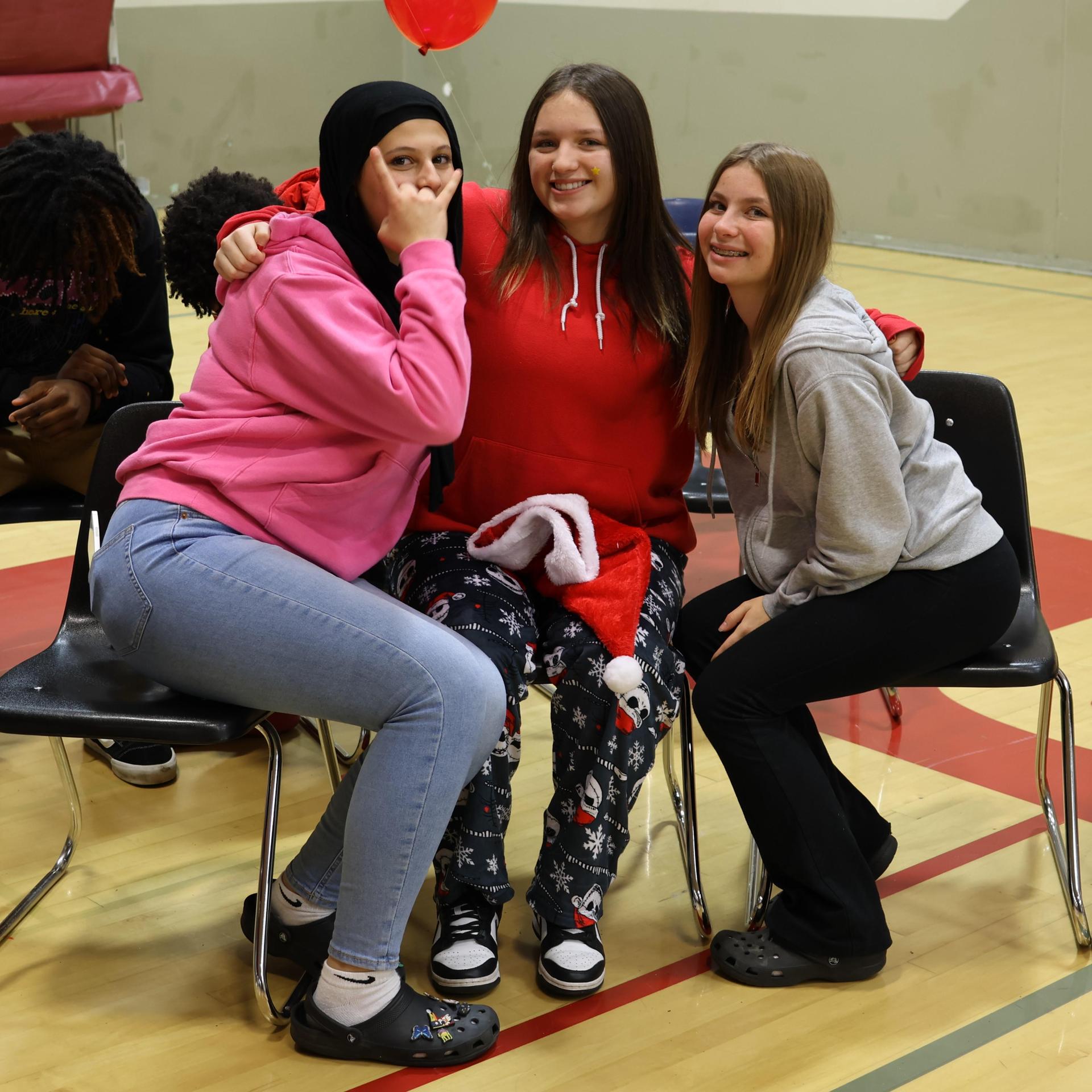 students and staff posing at the winter wishes rally