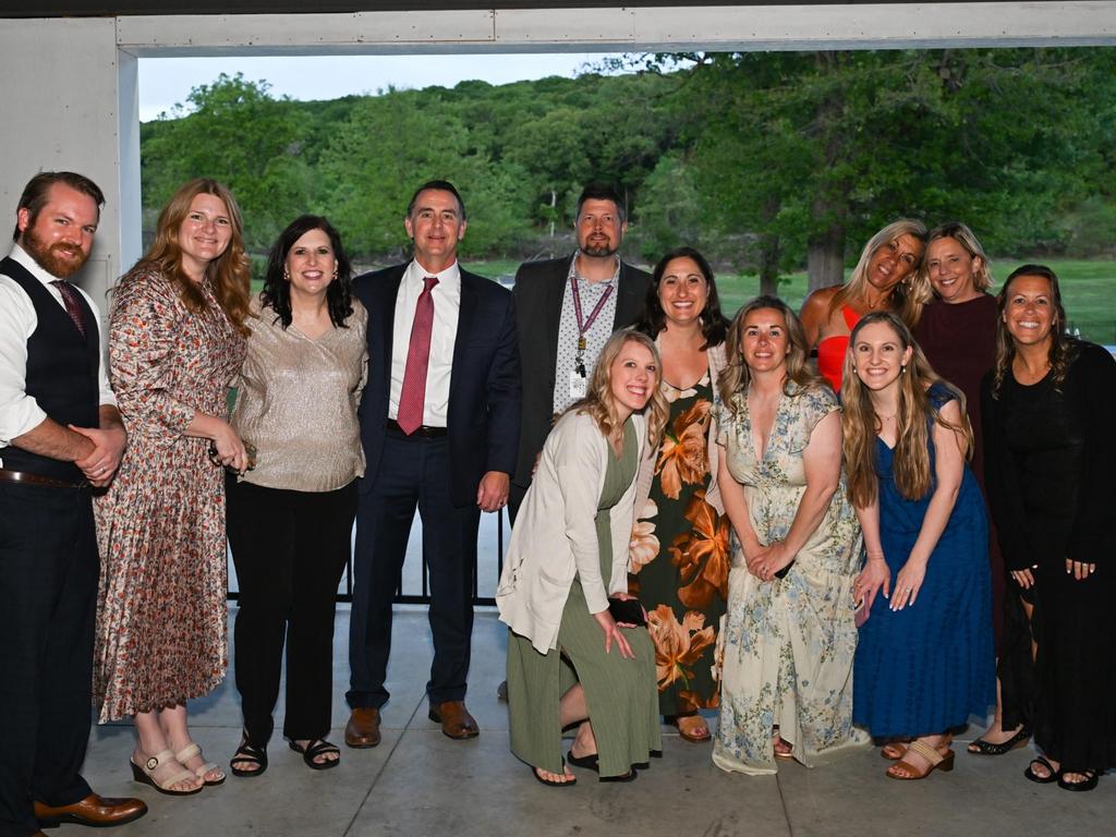A group photo of administrators, faculty and staff at the prom.